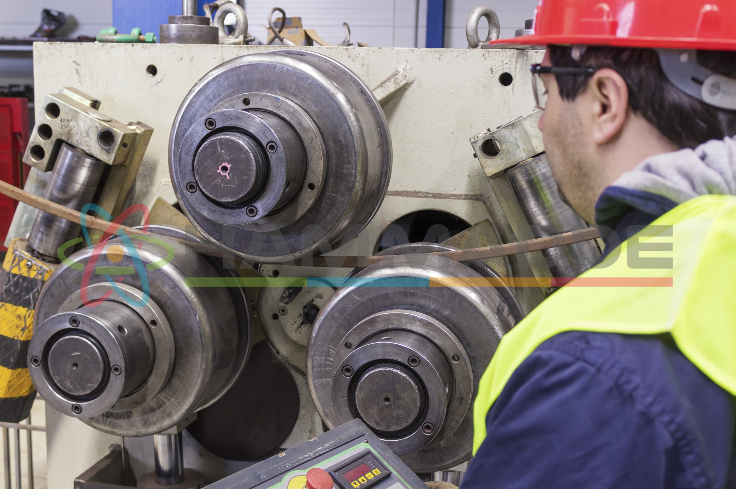 Machine bending metal pipe.