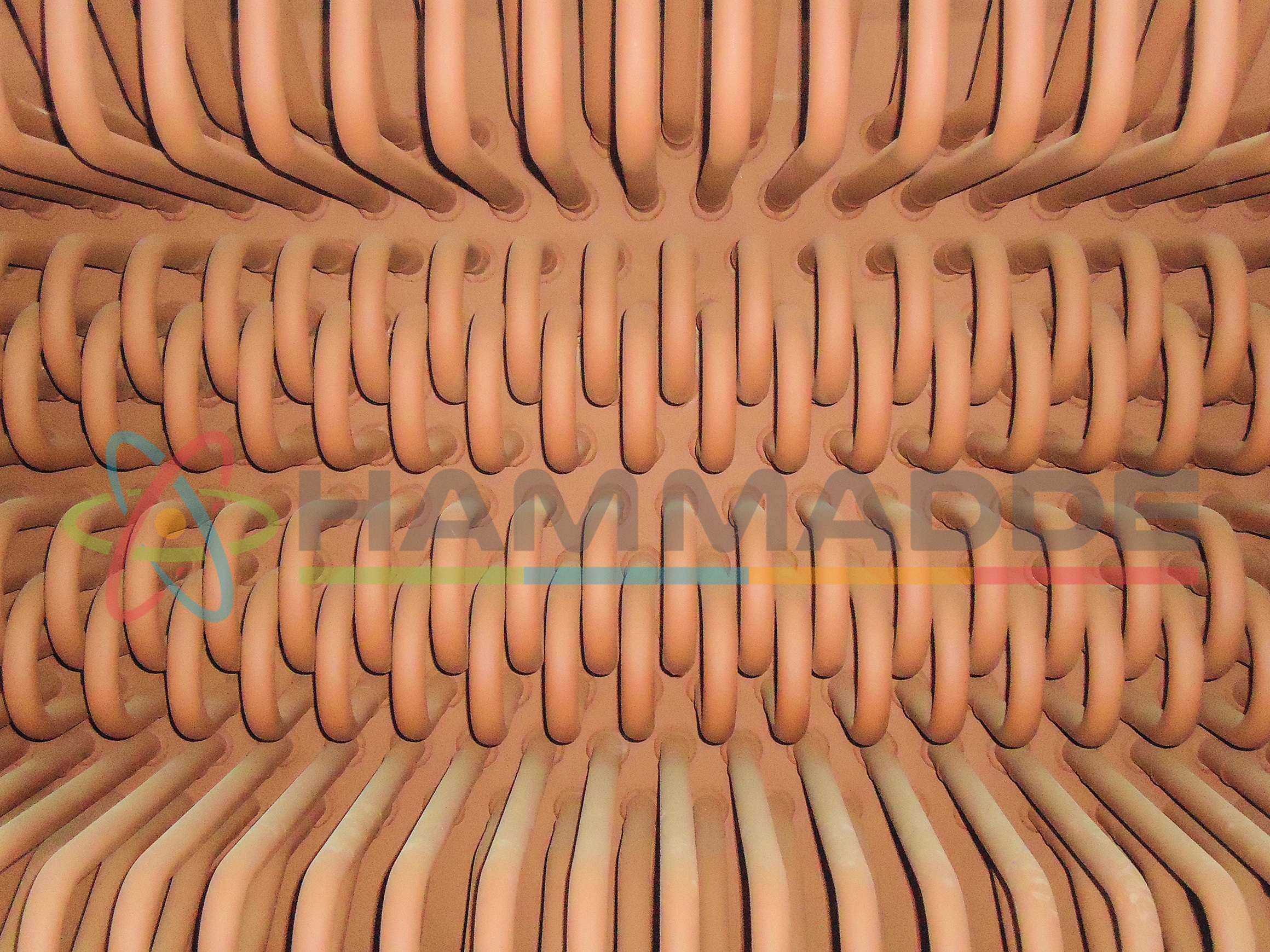 Industrial abstract background. Product of bent steel pipes close-up.