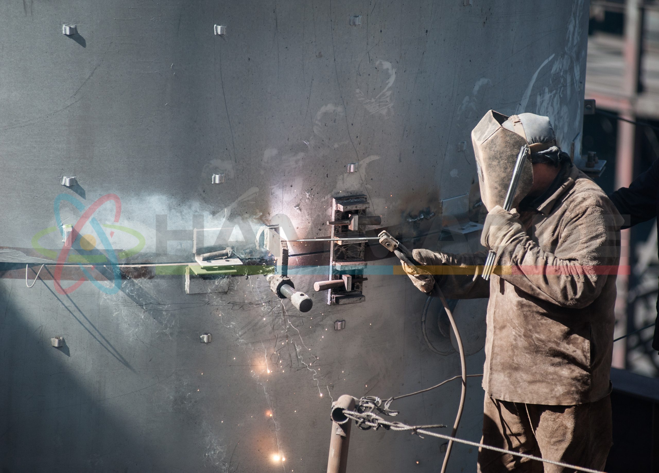 worker while doing a welding outdoor